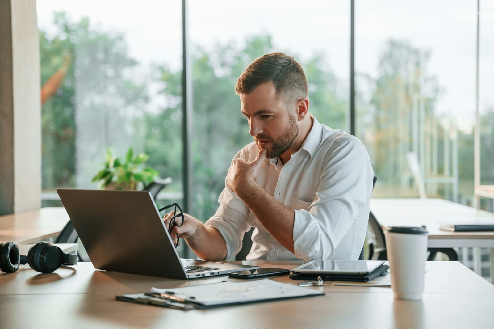 A brokerage handler reviewing renewals