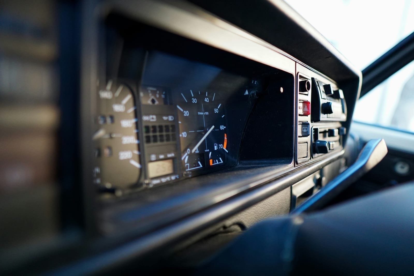 Driver checking the tachograph of a fleet vehicle